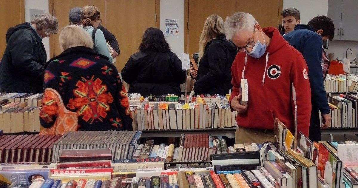 Patrons looking at books for sale at the Edgewater Public Library