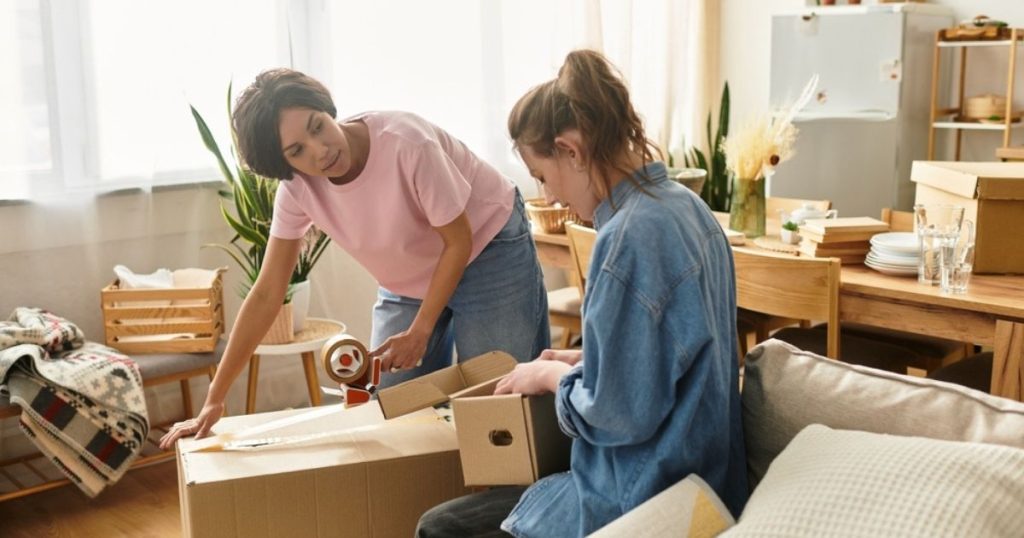 Two people packing a house during a move.