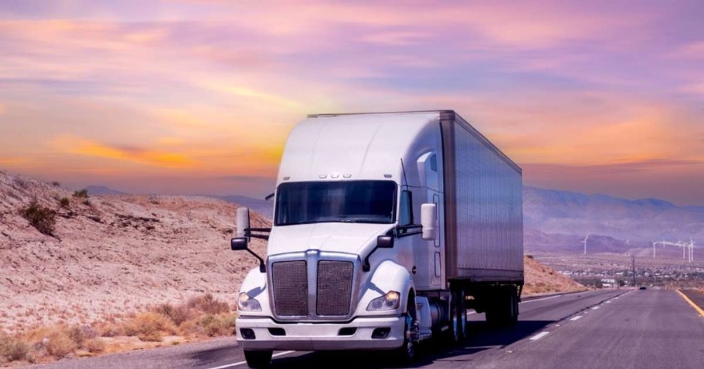 Moving truck traveling cross country from Saddle Brook at sunset.